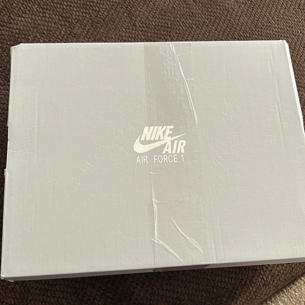 BRAND NEW, nike shoes, color is a brownish tan, never been wore or tired on.
